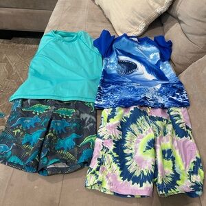 Blue and Green Swim Trunks with Ocean-Inspired Patterns